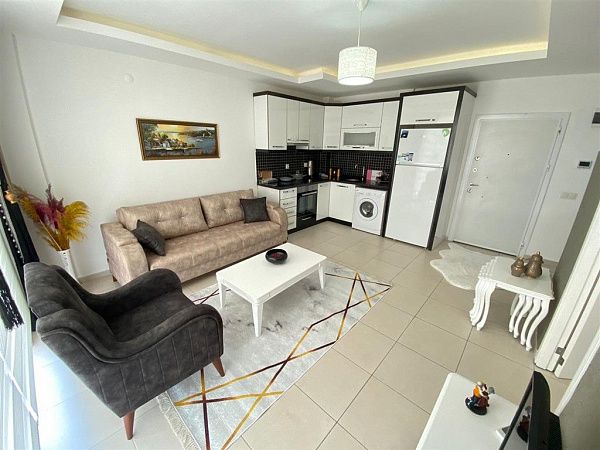 Недорогие апартаменты 1+1 с мебелью - район Махмутлар (№1090)